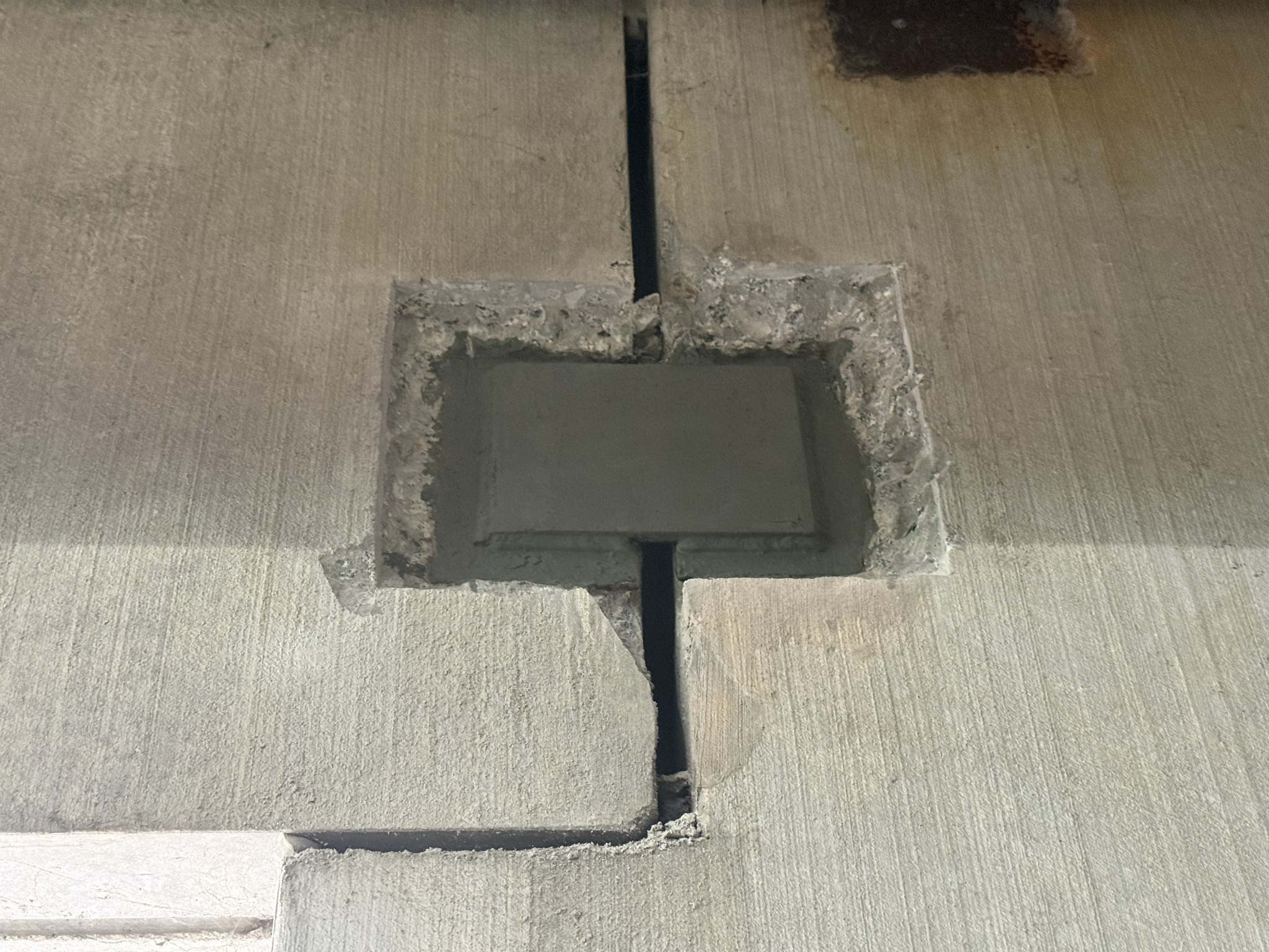 Precast concrete connection repair at a parking garage wall joint