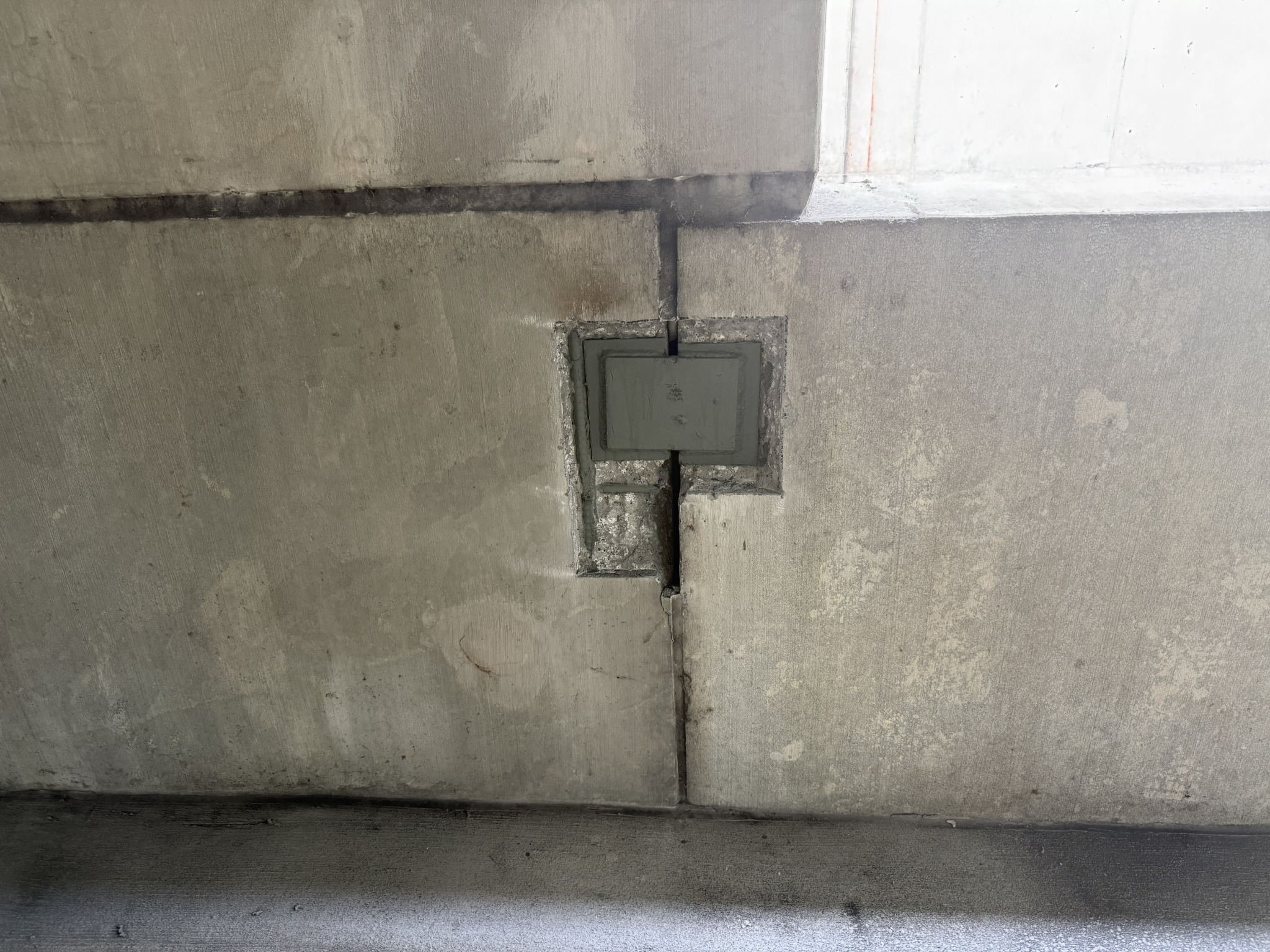 Precast parking structure joint and connection exposed for repair