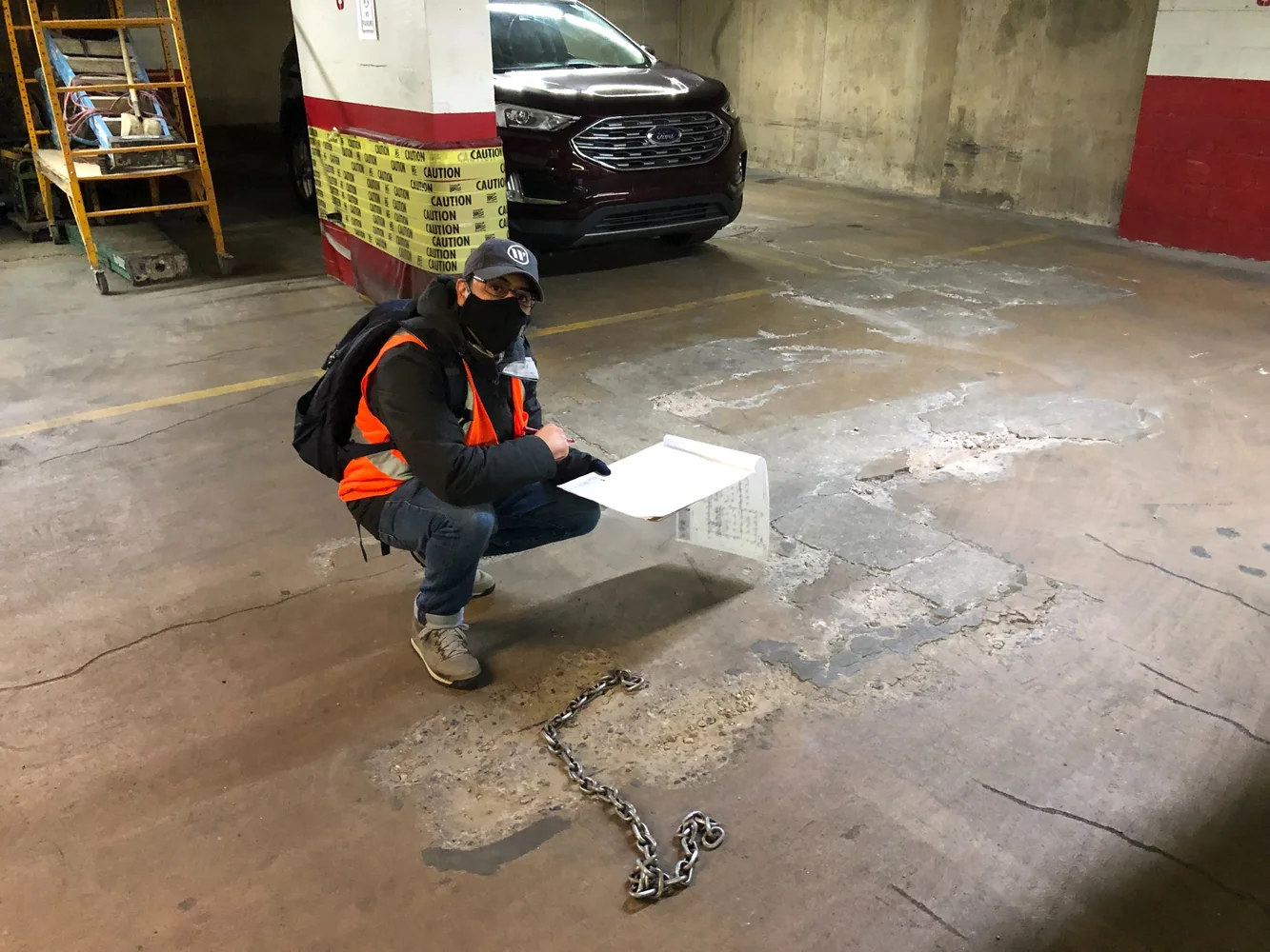 Engineer inspecting a New York City parking garage for structural deterioration