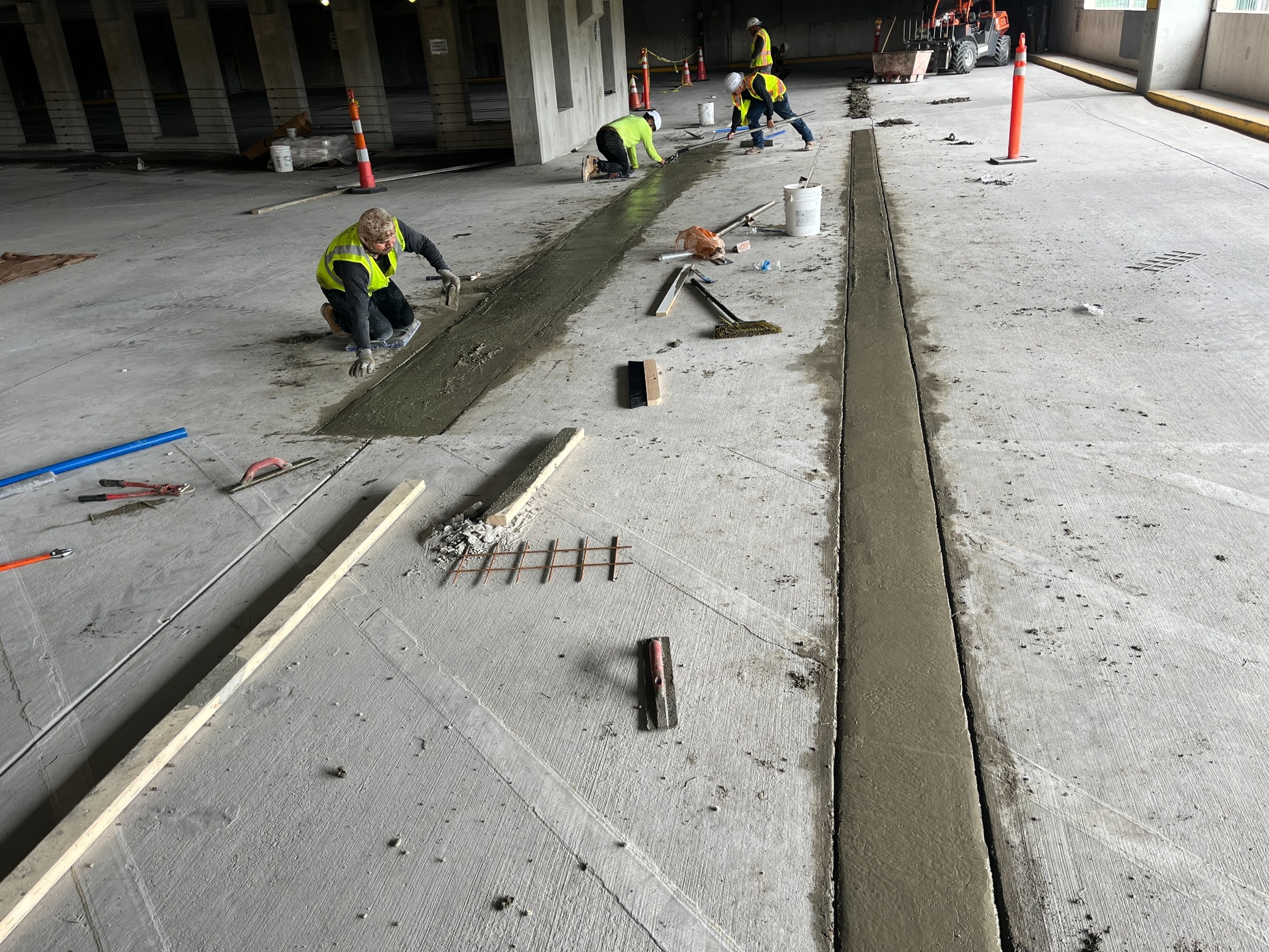 New concrete patch placement during New Hanover County parking deck repairs