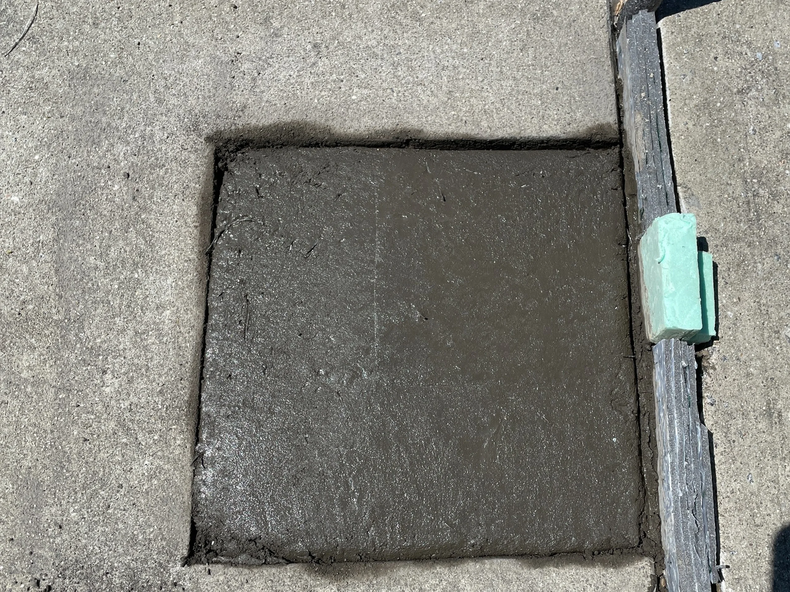 Completed concrete patch during Porter Building parking deck repairs in Charlotte, NC
