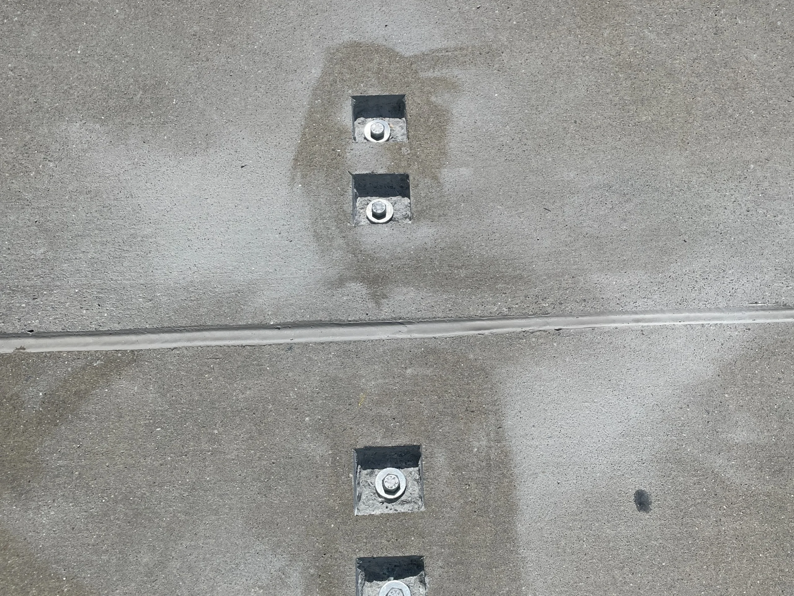Exposed precast double-tee shear connector repair locations at the Porter Building parking deck