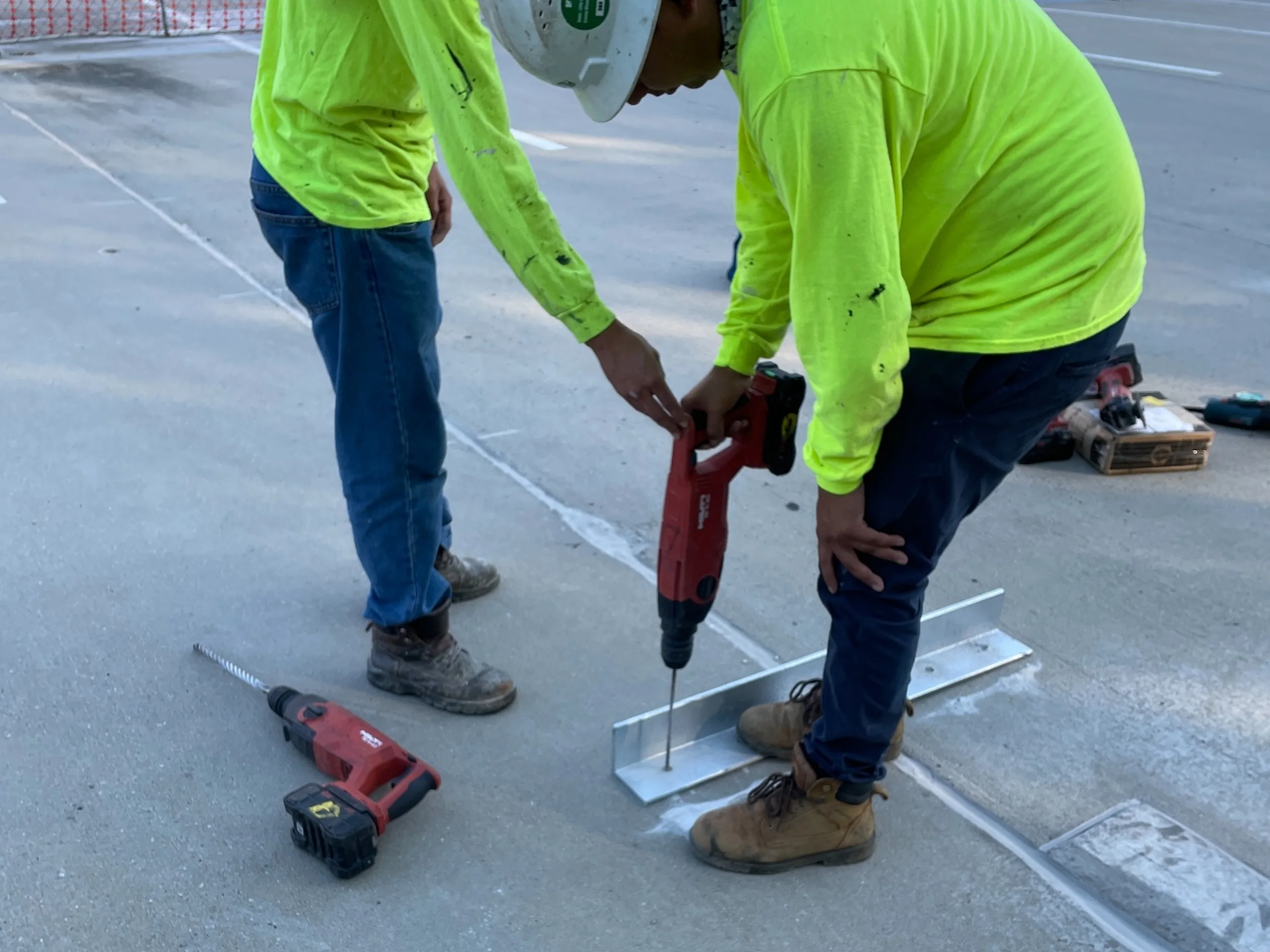 Drilling for supplemental shear connector repairs at the Porter Building parking deck